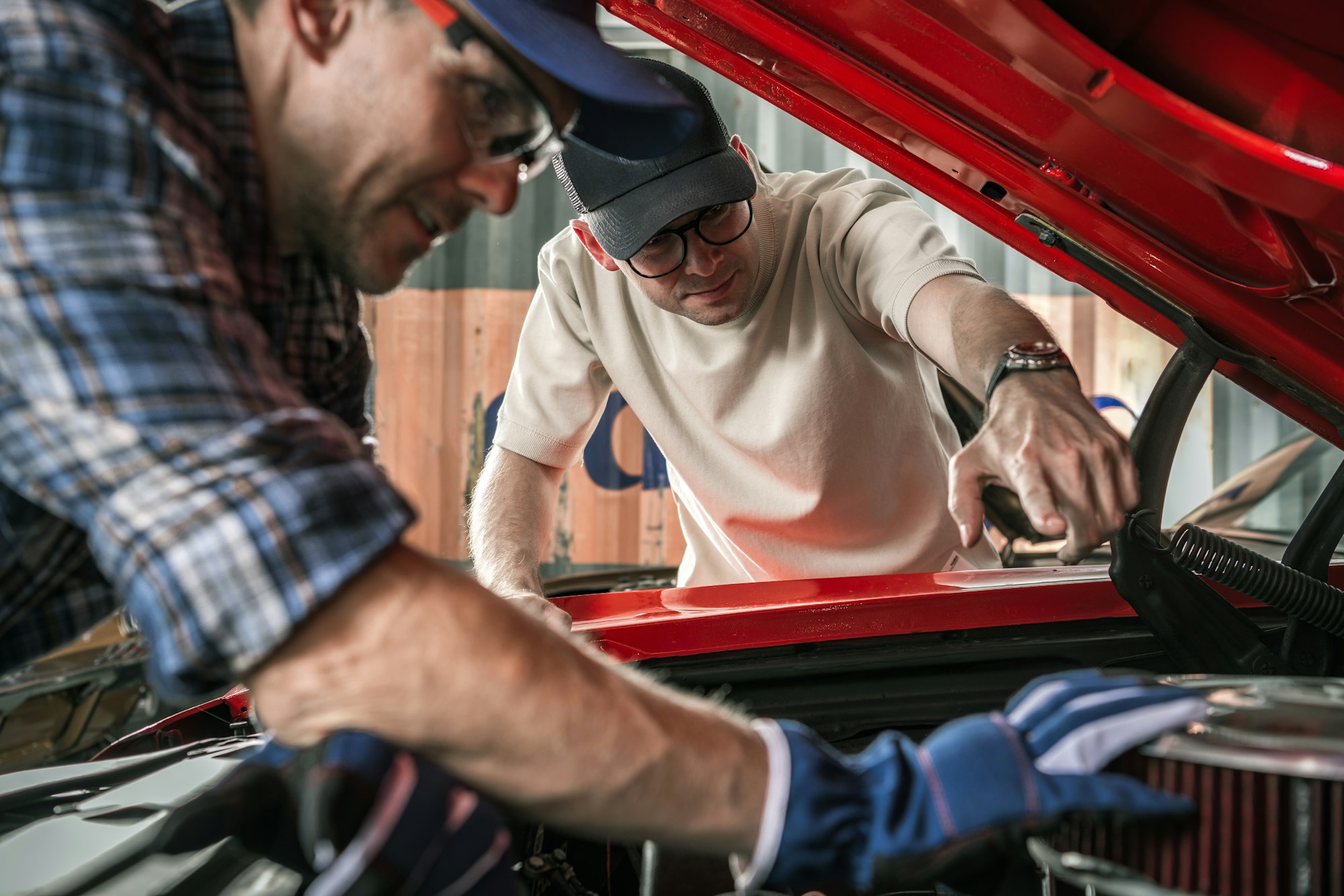 Classic Muscle Cars Enthusiasts Working On The Car Engine.jpg